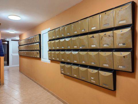 Rows of numbered metal letterboxes, one labelled Apt 105A, in an apartment hallway